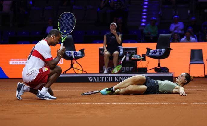 Stuttgart , Porsche Tennis Grand Prix , Doubles Mixed Showevent , v l Cacau kneels down after hitting Andrea Petkovics serve