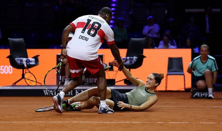 Stuttgart , Porsche Tennis Grand Prix , Doubles Mixed Showevent, f l Cacau helps Andrea Petkovic up after he has hit her with a ball and she is lying on the ground
