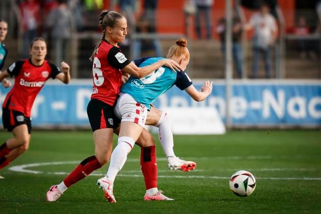 Womens soccer Bundesliga Bayer 04 Leverkusen 1 FC Köln, 14 04 2025 Juliette Vidal Bayer 04 Leverkusen, 56 and Laura Vogt 1 FC Köln, 8 in a duel Bayer 04 Leverkusen 1 FC Köln on matchday 19 of the Google Pixel Womens Bundesliga on 14 04 2025 at Ulrich Haberland Stadion in Leverkusen Nordrhein Westfalen DFL REGULATIONS PROHIBIT ANY USE OF PHOTOGRAPHS AS IMAGE SEQUENCES AND OR QUASI VIDEO Copyright: xBEAUTIFULxSPORTS AxelxKohringx