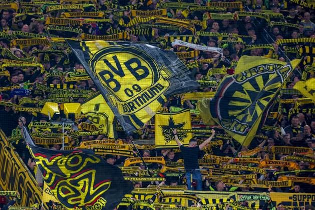 15 04 2025, Football, UEFA Champions League, Borussia Dortmund FC Barcelona, BVB Stadion, Quarter-final, Season 2024 2025 Feature Symbol Image Yellow Wall Fans Spectators Fans Symbol Photo Flag Flag Dynamics Scarf Parade Logo BVB Crest Regulations prohibit any use of photographs as image sequences and or quasi video North Rhine-Westphalia Germany