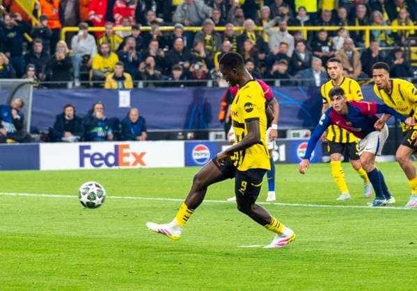 Serhou Guirassy Borussia Dortmund, 9 lobs the ball during the penalty kick goal Borussia Dortmund vs FC Barcelona, Football, UEFA Champions League quarter-final second leg, 2024 2025 season, 15 04 2025 DFL regulations prohibit any use of photographs as image sequences and or quasi video Copyright: HMBxMedia xMarcoxBader