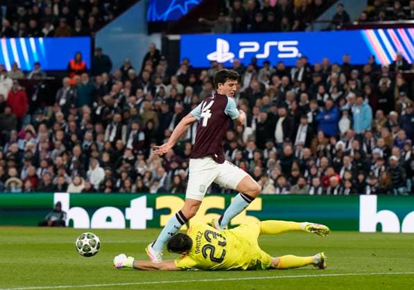 Birmingham, England, 15th April 2025. Aston Villa s Emiliano Martinez parries the ball into the path of Achraf Hakimi of Paris St Germain to score the first goal during the Aston Villa vs Paris Saint Germain Quarter Final 2nd Leg UEFA Champions League match at Villa Park, Birmingham. Picture credit should read: Andrew Yates Sportimage EDITORIAL USE ONLY. No use with unauthorised audio, video, data, fixture lists, club league logos or live services. Online in-match use limited to 120 images, no video emulation. No use in betting, games or single club league player publications. SPI_041_AY_Villa_PSG SPI-3842-0042
