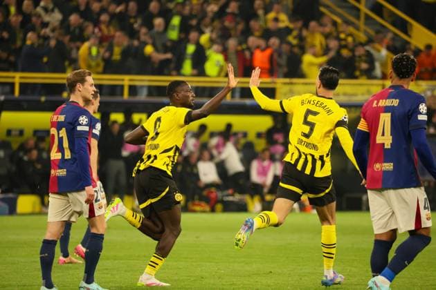 15 04 2025, xfanx, Football UEFA Champions League, Borussia Dortmund FC Barcelona v l Goalscorer Serhou Guirassy BVB converts the penalty and scores the goal to make it 1 0 for BVB and cheers with Ramy Bensebaini BVB DFL DFB REGULATIONS PROHIBIT ANY USE OF PHOTOGRAPHS as IMAGE SEQUENCES and or QUASI VIDEO Dortmund mfan
