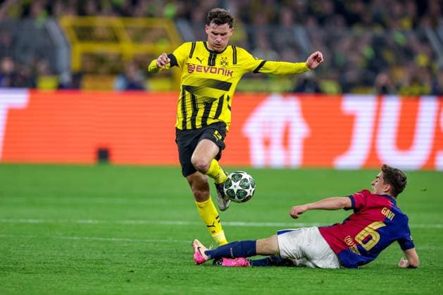 15 04 2025, Football, UEFA Champions League, Borussia Dortmund FC Barcelona, BVB Stadion, Quarter-final, Season 2024 2025 Pascal Groß BVB 13 in duel against Gavi Pablo Martin Paez Gavira FC Barcelona 06 Regulations prohibit any use of photographs as image sequences and or quasi video North Rhine-Westphalia Germany