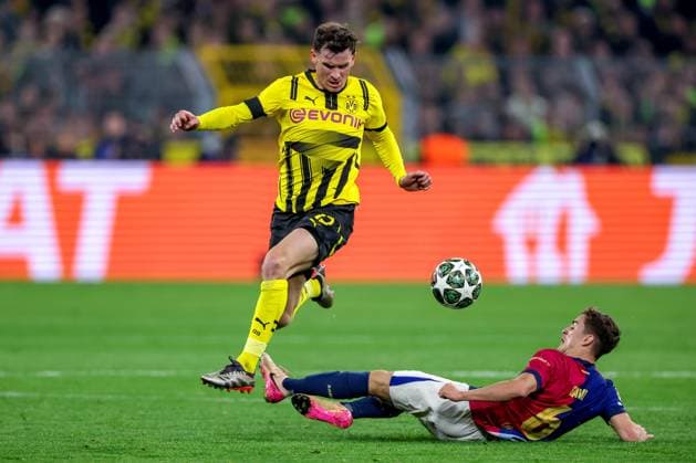 15 04 2025, Football, UEFA Champions League, Borussia Dortmund FC Barcelona, BVB Stadion, Quarter-final, Season 2024 2025 Pascal Groß BVB 13 in duel against Gavi Pablo Martin Paez Gavira FC Barcelona 06 Regulations prohibit any use of photographs as image sequences and or quasi video North Rhine-Westphalia Germany