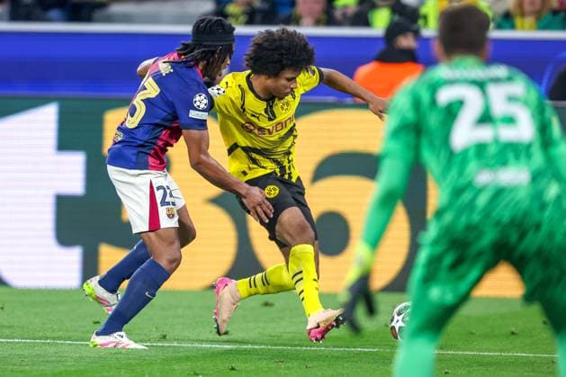 15 04 2025, Football, UEFA Champions League, Borussia Dortmund FC Barcelona, BVB Stadion, Quarter-final, Season 2024 2025 Jules Kounde FC Barcelona 23 in duel against Karim Adeyemi BVB 27 Regulations prohibit any use of photographs as image sequences and or quasi video Nordrhein Westfalen Germany