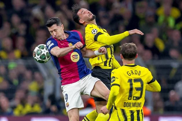 15 04 2025, Football, UEFA Champions League, Borussia Dortmund FC Barcelona, BVB Stadion, Quarter-final, Season 2024 2025 Robert Lewandowski FC Barcelona 09 in duel against Ramy Bensebaini BVB 5 Kopfball Kopfballduell Regulations prohibit any use of photographs as image sequences and or quasi video Nordrhein Westfalen Germany
