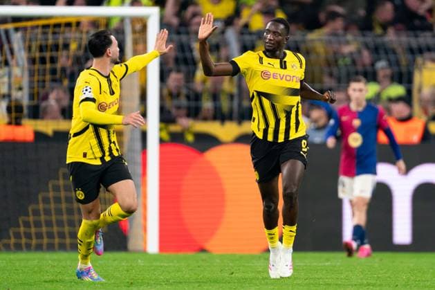 2025-04-15 Borussia Dortmund v FC Barcelona, Barca - UEFA Champions League 2024 25 Quarter Final Second Leg DORTMUND, GERMANY - APRIL 15: Serhou Guirassy of Borussia Dortmund celebrates after scoring the team s second goal with Ramy Bensebaini of Borussia Dortmund during the UEFA Champions League 2024 25 Quarter Final Second Leg match between Borussia Dortmund and FC Barcelona at BVB Stadion Dortmund on April 15, 2025 in Dortmund, Germany. Dortmund BVB Stadion Dortmund Germany Content not available for redistribution in The Netherlands directly or indirectly through any third parties. Copyright: xJorisxVerwijstx