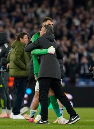 Birmingham, England, 15th April 2025. Luis Enrique coach of Paris St Germain hugs Gianluigi Donnarumma of Paris St Germain during the Aston Villa vs Paris Saint Germain Quarter Final 2nd Leg UEFA Champions League match at Villa Park, Birmingham. Picture credit should read: Andrew Yates Sportimage EDITORIAL USE ONLY. No use with unauthorised audio, video, data, fixture lists, club league logos or live services. Online in-match use limited to 120 images, no video emulation. No use in betting, games or single club league player publications. SPI_093_AY_Villa_PSG SPI-3842-0092