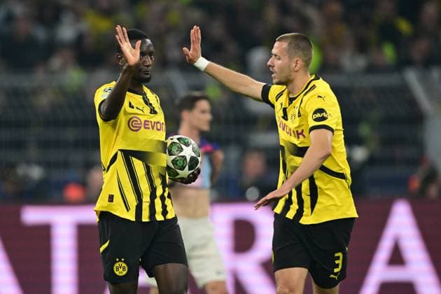 DORTMUND - (l-r) Sehrou Guirassy of Borussia Dortmund, Waldemar Anton of Borussia Dortmund celebrate Sehrou Guirassy of Borussia Dortmund s goal during the quarterfinal Champions League match between Borussia Dortmund and FC Barcelona, Barca at the Signal Iduna Park stadium on April 15, 2025 in Dortmund, Germany. ANP Hollandse Hoogte Borussia Dortmund v FC Barcelona 2024 25 xVIxANPxSportx xGerritxvanxKeulenxIVx 524606474 originalFilename: 524606474.jpg