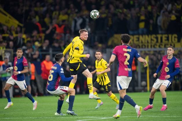 Maximilian BEIER DO vs Gerard MARTIN Barca header duel, action, duel, Football Champions League, Quarterfinal, Round of 8, Borussia Dortmund DO FC Barcelona Barca 3 1 on 15 04 2025 in Dortmund Germany UEFA regulations prohibit any use of photographs as image sequences and or quasi video Â