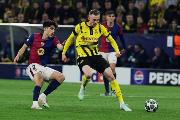 (250416) -- DORTMUND, April 16, 2025 -- Maximilian Beier (R) of Borussia Dortmund vies with Pau Cubarsi of FC Barcelona, Barca during the UEFA Champions League quarterfinal 2nd leg football match between Borussia Dortmund and FC Barcelona in Dortmund, Germany, April 15, 2025. (Photo by Xinhua) (SP)GERMANY-DORTMUND-FOOTBALL-UEFA CHAMPIONS LEAGUE-DORTMUND VS BARCELONA JoachimxBywaletz 