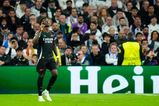 Real Madrid C.F. v Arsenal FC - UEFA Champions League 2024 25 Quarter Final Second Leg Bukayo Saka right winger of Arsenal and England celebrates after scoring his sides first goal during the UEFA Champions League 2024 25 Quarter Final Second Leg match between Real Madrid C.F. and Arsenal FC at Estadio Santiago Bernabeu on April 16, 2025 in Madrid, Spain. Madrid Spain  Copyright: xJosexBretonx originalFilename:bretonhernandez-realmadr250416_np5ZE.jpg