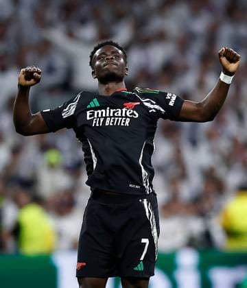 Bukayo Saka of Arsenal celebrates scoring a goal to make the score 0-1 Real Madrid v Arsenal, UEFA Champions League, Quarter-Finals, 2nd Leg, Football, Santiago Bernabu Stadium, Madrid, Spain - 16 Apr 2025 EDITORIAL USE ONLY No use with unauthorised audio, video, data, fixture lists, club league logos or live services. Online in-match use limited to 120 images, no video emulation. No use in betting, games or single club league player publications.  Copyright: xRubenxAlbarran Shutterstockx 15253938cj
