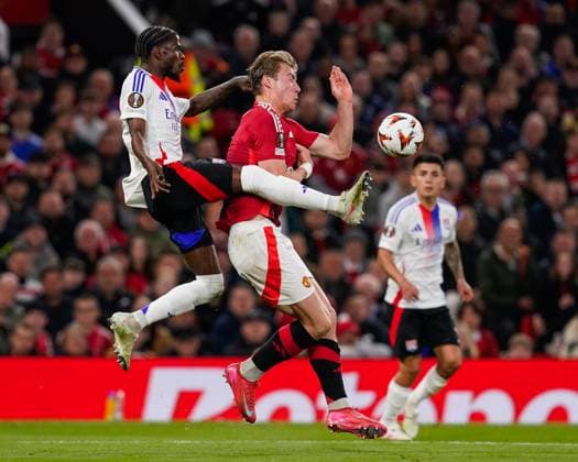 Manchester, England, 17th April 2025. Paul Akouokou of Lyon and Rasmus Hojlund of Manchester Unitedbattle for the ball during the Manchester United, ManU vs Olympique Lyonnais Quarter Final 2nd Leg UEFA Europa League match at Old Trafford, Manchester. Picture credit should read: Andrew Yates Sportimage EDITORIAL USE ONLY. No use with unauthorised audio, video, data, fixture lists, club league logos or live services. Online in-match use limited to 120 images, no video emulation. No use in betting, games or single club league player publications. SPI_058_AY_MANCHESTER_UNITED_V_OLYMPIQUE_LYONNAIS SPI-3844-0039