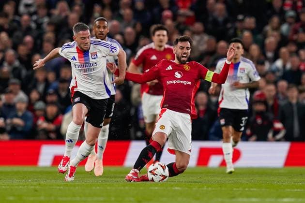 Manchester, England, 17th April 2025. Bruno Fernandes of Manchester United, ManU is fouled by Jordan Veretout of Lyonduring the Manchester United vs Olympique Lyonnais Quarter Final 2nd Leg UEFA Europa League match at Old Trafford, Manchester. Picture credit should read: Andrew Yates Sportimage EDITORIAL USE ONLY. No use with unauthorised audio, video, data, fixture lists, club league logos or live services. Online in-match use limited to 120 images, no video emulation. No use in betting, games or single club league player publications. SPI_059_AY_MANCHESTER_UNITED_V_OLYMPIQUE_LYONNAIS SPI-3844-0040