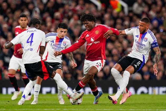 Manchester, England, 17th April 2025. Patrick Dorgu of Manchester United, ManU and Paul Akouokou of Lyon battle for the ball during the Manchester United vs Olympique Lyonnais Quarter Final 2nd Leg UEFA Europa League match at Old Trafford, Manchester. Picture credit should read: Andrew Yates Sportimage EDITORIAL USE ONLY. No use with unauthorised audio, video, data, fixture lists, club league logos or live services. Online in-match use limited to 120 images, no video emulation. No use in betting, games or single club league player publications. SPI_063_AY_MANCHESTER_UNITED_V_OLYMPIQUE_LYONNAIS SPI-3844-0043
