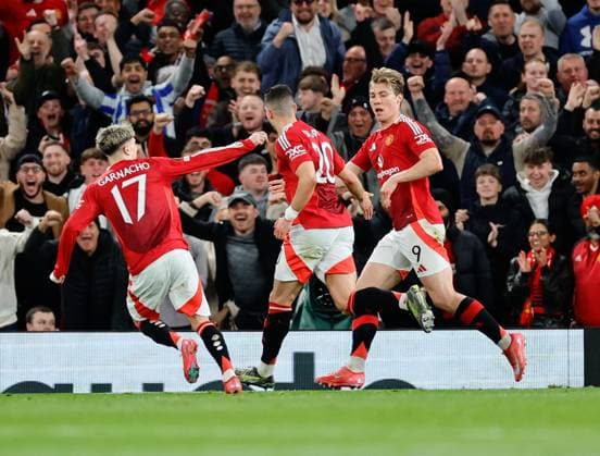 17th April 2025; Old Trafford, Manchester, England; Europa League Quarter Final Second Leg Football, Manchester United, ManU versus Lyon; United players celebrate a goal scored by Diogo Dalot of Manchester United (20) in the 45th minute to make the score 2-0  ActionPlus12775554 RogerxEvans