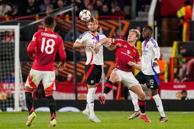 Manchester, England, 17th April 2025. Tanner Tessmann of Lyon and Rasmus Hojlund of Manchester United, ManU battle for the ball during the Manchester United vs Olympique Lyonnais Quarter Final 2nd Leg UEFA Europa League match at Old Trafford, Manchester. Picture credit should read: Andrew Yates Sportimage EDITORIAL USE ONLY. No use with unauthorised audio, video, data, fixture lists, club league logos or live services. Online in-match use limited to 120 images, no video emulation. No use in betting, games or single club league player publications. SPI_094_AY_MANCHESTER_UNITED_V_OLYMPIQUE_LYONNAIS SPI-3844-0061