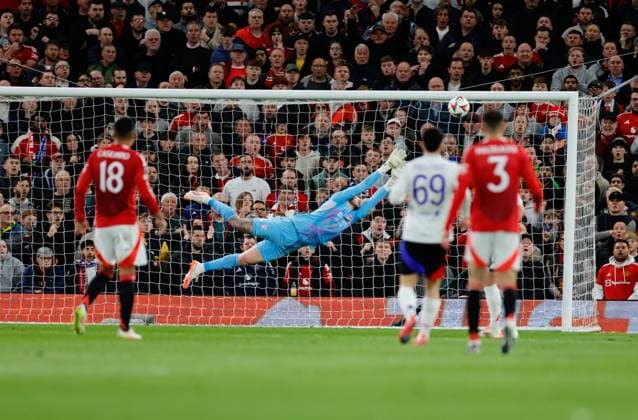 17th April 2025; Old Trafford, Manchester, England; Europa League Quarter Final Second Leg Football, Manchester United, ManU versus Lyon; Lucas Perri of Lyon watches the shopt from Fernandez hit the bar  ActionPlus12775598 RogerxEvans