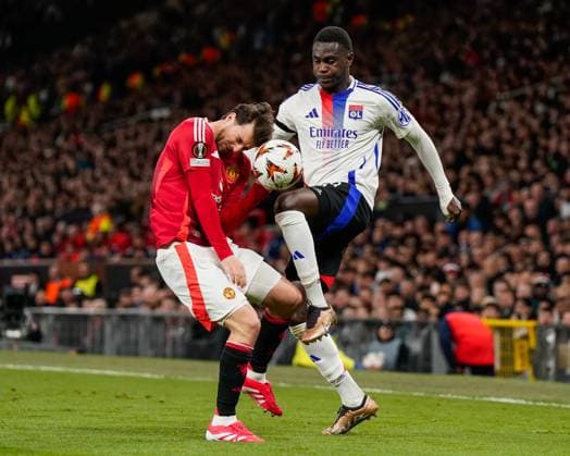 Manchester, England, 17th April 2025. Mason Mount of Manchester United, ManU and Moussa NiakhatÃ of Lyon battle for the ball during the Manchester United vs Olympique Lyonnais Quarter Final 2nd Leg UEFA Europa League match at Old Trafford, Manchester. Picture credit should read: Andrew Yates Sportimage EDITORIAL USE ONLY. No use with unauthorised audio, video, data, fixture lists, club league logos or live services. Online in-match use limited to 120 images, no video emulation. No use in betting, games or single club league player publications. SPI_108_AY_MANCHESTER_UNITED_V_OLYMPIQUE_LYONNAIS SPI-3844-0074