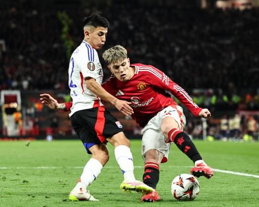UEFA Europa League Quarter-finals Manchester United, ManU v Lyon Thiago Almada of Lyon tackles Alejandro Garnacho of Manchester United during the UEFA Europa League Quarter-finals match Manchester United vs Lyon at Old Trafford, Manchester, United Kingdom, 17th April 2025 (Photo by Mark Cosgrove News Images) Manchester Old Trafford Greater Manchester United Kingdom Copyright: xMarkxCosgrove NewsxImagesx