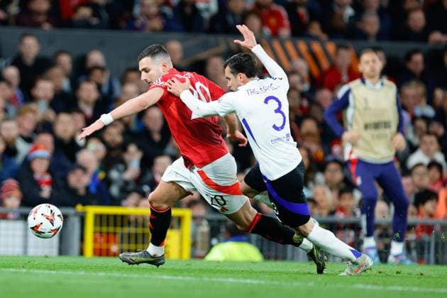 17th April 2025; Old Trafford, Manchester, England; Europa League Quarter Final Second Leg Football, Manchester United, ManU versus Lyon; Diogo Dalot of Manchester United tracked by Nicolas Tagliafico of Lyon  ActionPlus12775692 RogerxEvans