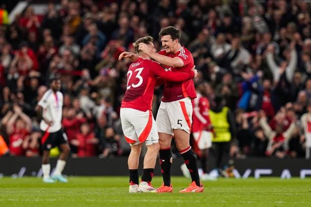 Manchester, England, 17th April 2025. Harry Maguire of Manchester United, ManU and Luke Shaw of Manchester United celebrate at the end of the Manchester United vs Olympique Lyonnais Quarter Final 2nd Leg UEFA Europa League match at Old Trafford, Manchester. Picture credit should read: Andrew Yates Sportimage EDITORIAL USE ONLY. No use with unauthorised audio, video, data, fixture lists, club league logos or live services. Online in-match use limited to 120 images, no video emulation. No use in betting, games or single club league player publications. SPI_195_AY_MANCHESTER_UNITED_V_OLYMPIQUE_LYONNAIS SPI-3844-0116