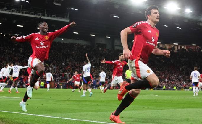 17th April 2025; Old Trafford, Manchester, England; Europa League Quarter Final Second Leg Football, Manchester United, ManU versus Lyon; Kobbie Mainoo celebrates after Harry Maguire of Manchester United scores in the 121st minute to make the score 5-4 to United  ActionPlus12775756 RogerxEvans