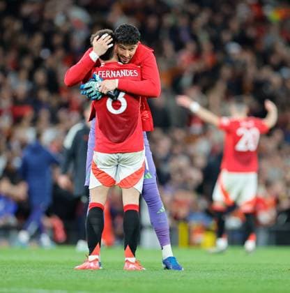 17th April 2025; Old Trafford, Manchester, England; Europa League Quarter Final Second Leg Football, Manchester United, ManU versus Lyon; Altay Bay& x131;nd& x131;r of Manchester United hugs Bruno Fernandes of Manchester United after the 5-4 win  ActionPlus12775774 RogerxEvans