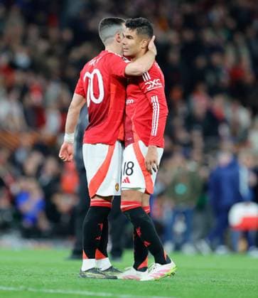 17th April 2025; Old Trafford, Manchester, England; Europa League Quarter Final Second Leg Football, Manchester United, ManU versus Lyon; Diogo Dalot of Manchester United hugs Casemiro after the 5-4 win over Lyon  ActionPlus12775779 RogerxEvans