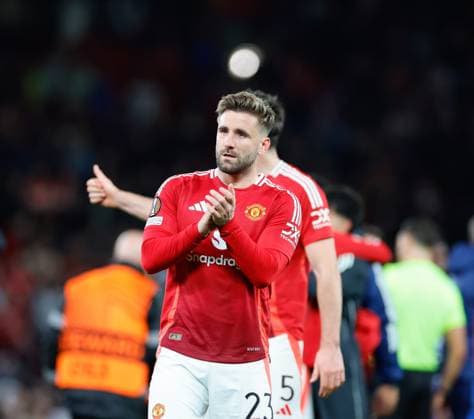 17th April 2025; Old Trafford, Manchester, England; Europa League Quarter Final Second Leg Football, Manchester United, ManU versus Lyon; Luke Shaw of Manchester United salutes the crowd celebrates after the 5-4 win over Lyon  ActionPlus12775780 RogerxEvans