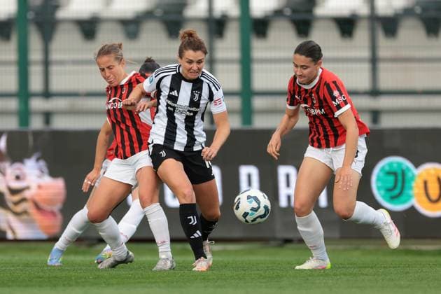 Biella, Italy, 18th April 2025.Cristiana Girelli of Juventus takes on Valentina Cernoia and Nadine Sorelli of AC Milan during the Juventus Women vs AC Milan Women Serie A Femminile match at Stadio Vittorio Pozzo, Biella. Picture credit should read: Jonathan Moscrop Sportimage EDITORIAL USE ONLY. No use with unauthorised audio, video, data, fixture lists, club league logos or live services. Online in-match use limited to 120 images, no video emulation. No use in betting, games or single club league player publications. SPI_046_JM_JUVE_MILAN_FEMM_ SPI-3835-0046