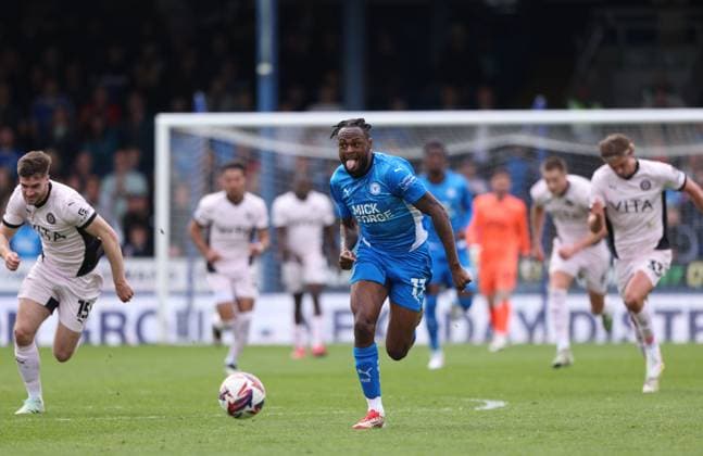 Ricky Jade-Jones (PU) bursts through to score the first Posh goal (1-0) at the Peterborough United v Stockport County EFL League One match, at the Weston Homes Stadium, Peterborough, Cambridgeshire, on 18th April, 2025. 