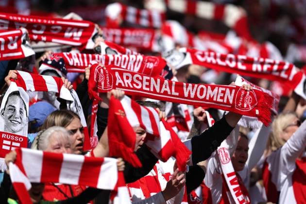 London, England, 19th April 2025. Arsenal fans hold up their scarves before the Arsenal Women vs Olympique Lyonnais UEFA Womens Champions League match at the Emirates Stadium, London. Picture credit should read: Paul Terry Sportimage EDITORIAL USE ONLY. No use with unauthorised audio, video, data, fixture lists, club league logos or live services. Online in-match use limited to 120 images, no video emulation. No use in betting, games or single club league player publications. SPI_029_PT_Arsenal_w_Lyon_W SPI-3848-0032