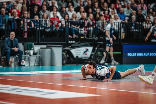Volleyball Men Season 2024 2025 Volleyball Bundesliga Playoff Semifinal Game 5 SVG Lüneburg vs VfB Friedrichshafen 19 04 2025 Xander Wolf Wassenaar Ketrzynski 11 SVG Lüneburg lies on the ground after defense Lüneburg LKH Arena Niedersachsen Germany