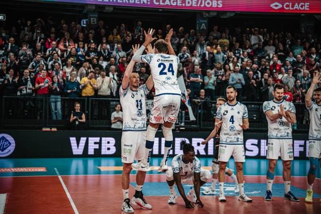 Volleyball mens season 2024 2025 Volleyball Bundesliga playoff semi-final match 5 SVG Lüneburg vs VfB Friedrichshafen 19 04 2025 Marcus Böhme 11 VfB Friedrichshafen and Wessel Keemink 24 VfB Friedrichshafen jump to high-five as they enter the LKH Arena Lüneburg LKH Arena Niedersachsen Germany
