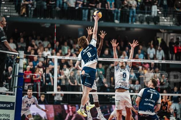 Volleyball Men Season 2024 2025 Volleyball Bundesliga Playoff Semifinal Match 5 SVG Lüneburg vs VfB Friedrichshafen 19 04 2025 Oskar Alve Espeland 9 SVG Lüneburg against the block of Jose Israel Masso Alvarez 1 VfB Friedrichshafen and Marcus Böhme 11 VfB Friedrichshafen Lüneburg LKH Arena Niedersachsen Germany