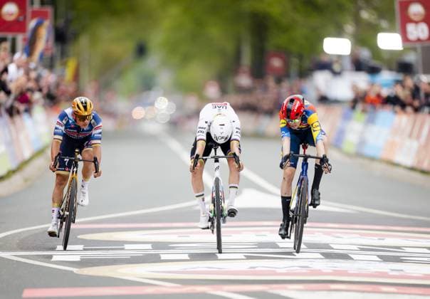 VALKENBURG - Remco Evenepoel (Belgium), Tadej Pogacar (Slovenia) and Mattias Skjelmose (Denmark) cross the finish line of the 2025 Amstel Gold Race in Valkenburg. ANP MARCEL VAN HOORN Amstel Gold Race 2025 xVIxANPxSportx xxANPxIVx 524902758 originalFilename: 524902758.jpg