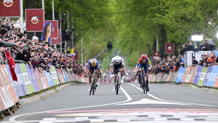 Belgian Remco Evenepoel of Soudal Quick-Step, Slovenian Tadej Pogacar of UAE Team Emirates and Danish Mattias Skjelmose Jensen of Lidl-Trek sprint to the finish of the men elite Amstel Gold Race one day cycling race, 255,9 km from Maastricht to Valkenburg, The Netherlands, Sunday 20 April 2025. DIRKxWAEM  x121320788x