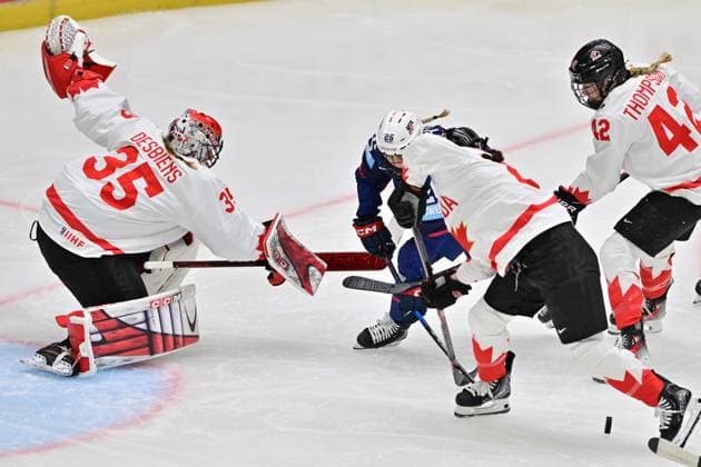 (L-R) Goalkeeper Ann-Renee Desbiens of Canada, Kendall Coyne Schofield of USA, Erin Ambrose and Claire Thompson of Canada in action during the Ice hockey, Eishockey IIHF WomenÂ s World Championship, WM, Weltmeisterschaft the gold medal match USA vs Canada, Ceske Budejovice, Czech Republic, April 20, 2025. (CTKxPhoto VaclavxPancer) CTKPhotoP2025042004196  CTKPhotoP2025042004196