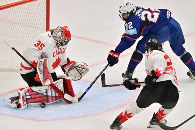 (L-R) Goalkeeper Ann-Renee Desbiens of Canada, Tessa Janecke od USA and Erin Ambrose of Canada in action during the Ice hockey, Eishockey IIHF WomenÂ s World Championship, WM, Weltmeisterschaft the gold medal match USA vs Canada, Ceske Budejovice, Czech Republic, April 20, 2025. (CTKxPhoto VaclavxPancer) CTKPhotoP2025042004317  CTKPhotoP2025042004317