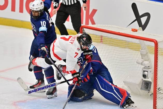 (L-R) Laila Edwards of USA, Laura Stacey of Canada and goalkeeper Gwyneth Philips of USA in action during the Ice hockey, Eishockey IIHF WomenÂ s World Championship, WM, Weltmeisterschaft the gold medal match USA vs Canada, Ceske Budejovice, Czech Republic, April 20, 2025. (CTKxPhoto VaclavxPancer) CTKPhotoP2025042005335  CTKPhotoP2025042005335