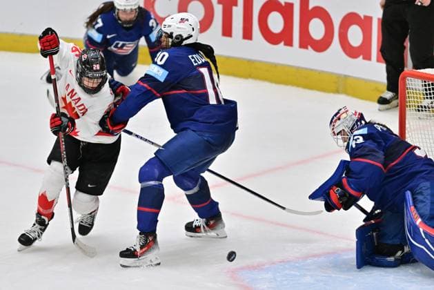 (L-R) Emily Clark of Canada, Laila Edwards of USA and goalkeeper Gwyneth Philips of USA in action during the Ice hockey, Eishockey IIHF WomenÂ s World Championship, WM, Weltmeisterschaft the gold medal match USA vs Canada, Ceske Budejovice, Czech Republic, April 20, 2025. (CTKxPhoto VaclavxPancer) CTKPhotoP2025042005394  CTKPhotoP2025042005394