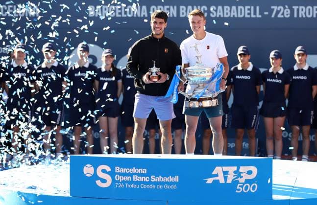 April 20, 2025, Sabadell, Barcelona, Spain: Barcelona Spain 20.04.2025 Carlos Alcaraz (Spain) and Holger Rune (Denmark) pose with the titles in the match between Carlos Alcaraz (Spain) and Holger Rune (Denmark) during the Day 7 of the Barcelona Open Banc Sabadell Godo on 20 April 2025 in Barcelona. Sabadell Spain - ZUMAu50_ 20250420_zsp_u50_058 Copyright: xXavixUrgelesx