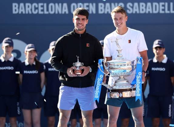 April 20, 2025, Sabadell, Barcelona, Spain: Barcelona Spain 20.04.2025 Carlos Alcaraz (Spain) and Holger Rune (Denmark) pose with the titles in the match between Carlos Alcaraz (Spain) and Holger Rune (Denmark) during the Day 7 of the Barcelona Open Banc Sabadell Godo on 20 April 2025 in Barcelona. Sabadell Spain - ZUMAu50_ 20250420_zsp_u50_080 Copyright: xXavixUrgelesx