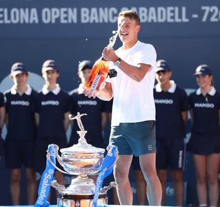 April 20, 2025, Sabadell, Barcelona, Spain: Barcelona Spain 20.04.2025 Holger Rune (Denmark) celebrates his victory with cava in the match between Carlos Alcaraz (Spain) and Holger Rune (Denmark) during the Day 7 of the Barcelona Open Banc Sabadell Godo on 20 April 2025 in Barcelona. Sabadell Spain - ZUMAu50_ 20250420_zsp_u50_107 Copyright: xXavixUrgelesx