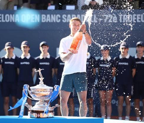 April 20, 2025, Sabadell, Barcelona, Spain: Barcelona Spain 20.04.2025 Holger Rune (Denmark) celebrates his victory with cava in the match between Carlos Alcaraz (Spain) and Holger Rune (Denmark) during the Day 7 of the Barcelona Open Banc Sabadell Godo on 20 April 2025 in Barcelona. Sabadell Spain - ZUMAu50_ 20250420_zsp_u50_125 Copyright: xXavixUrgelesx