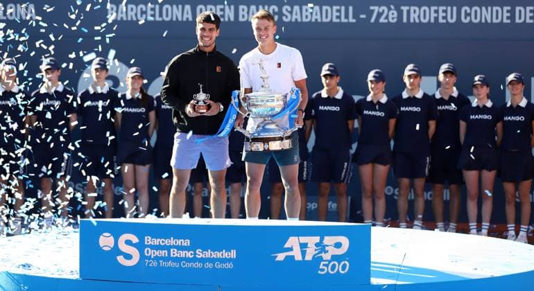 April 20, 2025, Sabadell, Barcelona, Spain: Barcelona Spain 20.04.2025 Carlos Alcaraz (Spain) and Holger Rune (Denmark) pose with the titles in the match between Carlos Alcaraz (Spain) and Holger Rune (Denmark) during the Day 7 of the Barcelona Open Banc Sabadell Godo on 20 April 2025 in Barcelona. Sabadell Spain - ZUMAu50_ 20250420_zsp_u50_126 Copyright: xXavixUrgelesx