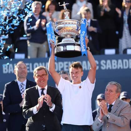 April 20, 2025, Sabadell, Barcelona, Spain: Barcelona Spain 20.04.2025 Holger Rune (Denmark) lifts the Barcelona Open title in the match between Carlos Alcaraz (Spain) and Holger Rune (Denmark) during the Day 7 of the Barcelona Open Banc Sabadell Godo on 20 April 2025 in Barcelona. Sabadell Spain - ZUMAu50_ 20250420_zsp_u50_138 Copyright: xXavixUrgelesx